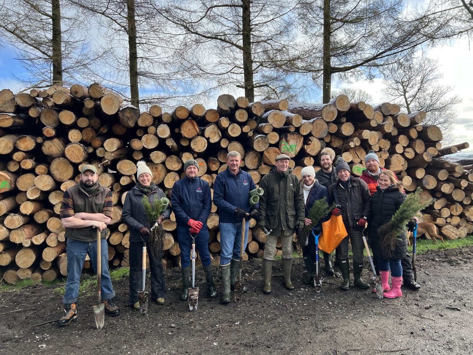 Group of people at Swinton Estate participating in tree planting as part of an ESG and climate action initiative