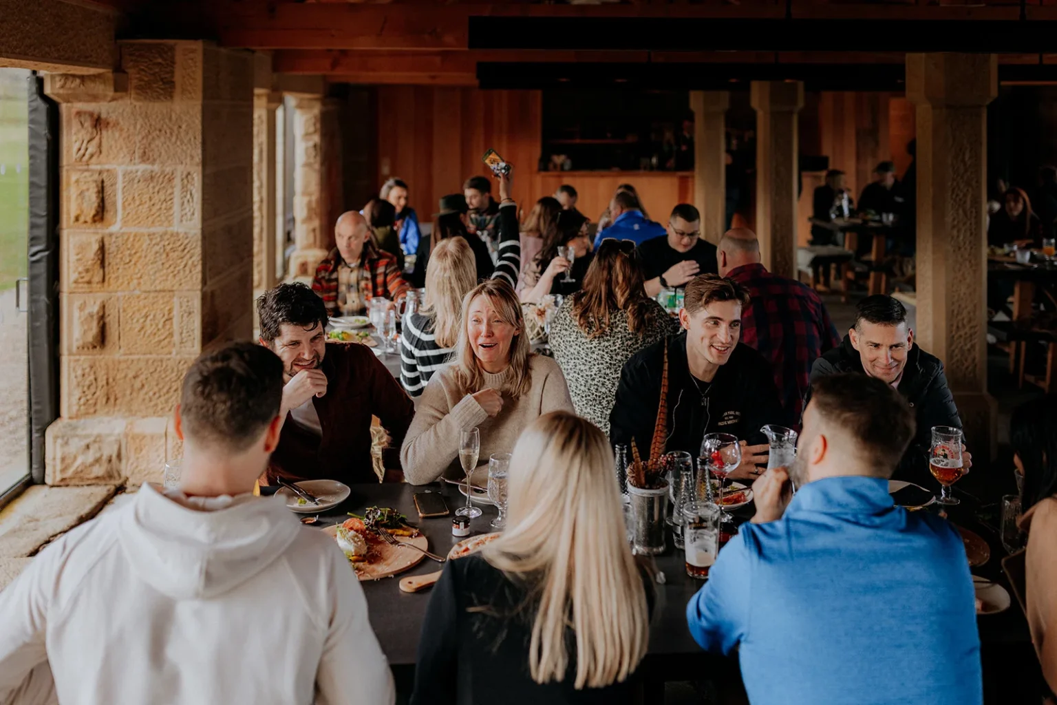 People enjoying a meal at Swinton Estate showcasing sustainability partnerships and a commitment to meaningful climate action